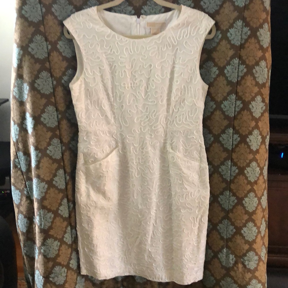 Off white dress with pockets and raised patterns